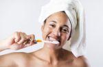 Pretty Young Woman Brushing Her Teeth Stock Photo