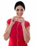 Girl Holding Headphone Stock Photo