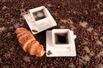 Coffee Beans And Croissant Stock Photo