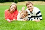 Smiling Young Family In Outdoors Stock Photo