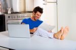 Man Reading Newspaper Laptop Kitchen Stock Photo