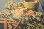 Dried Herbs And Ginseng, Top View Of Thai Herbs And Ginseng On Wooden Floor Stock Photo