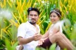 Happy Asian Couple Play Together With Bubble Garden Stock Photo