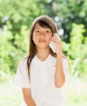 Asia Girl Use Smart Phone In Garden Stock Photo