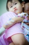 Mother Carrying Sick Baby,shallow Dof Stock Photo