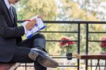 Close Up Young Businessman Looking At Report Paper Stock Photo