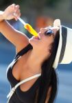 Portrait Of Beautiful Girl Eating Ice Cream Stock Photo