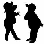 Silhouettes Of Two Little Boys Stock Photo