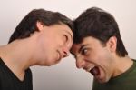 Woman And Man Yelling Face To Face Stock Photo