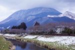 Small Village With Mountain And River Stock Photo