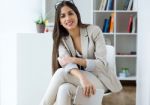 Pretty Young Woman Using Digital Tablet In The Office Stock Photo