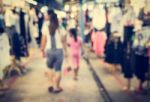 Blurred People Walking In The Market Stock Photo