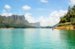 High Mountain Range Above The Green Lake Stock Photo