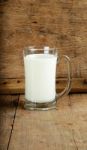 Glass With Milk On The Wooden Background Stock Photo