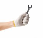 Working Hand In Glove Holding Wrench Stock Photo