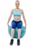 Sporty Woman Exercising With Blue Ball Stock Photo