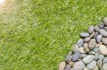 Stone On Grass Background Stock Photo