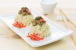 Rice Topped With Stir-fried Pork And Basil And Chopsticks And Small Cup Stock Photo