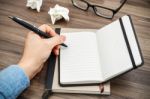 Woman Hand Writing On Notebook Stock Photo