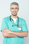 Confident Smiling Young Doctor Posing Stock Photo