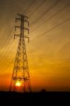 Electric Pylon At Sunset Stock Photo