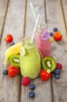 Fresh Blended Fruit Smoothies In Vintage Milk Bottles Stock Photo