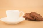 White Mug Of Hot Coffee And Chocolate Cookies Stock Photo