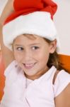 Smiling Girl Wearing Christmas Hat Stock Photo