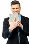 Businessman Operating Tablet Device Stock Photo