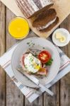 Poached Egg And Bacon On Rye Bread, Healthy Breakfast Stock Photo