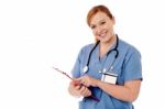 Young Female Specialist Holding Clipboard Stock Photo