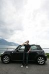 Young Man Talking On Phone Near Car Stock Photo