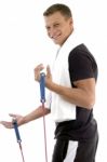 Exercising Man With Stretching Rope Stock Photo