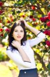 Young Beautiful Woman With Long Straight Dark Hair Posing In Spr Stock Photo