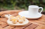 Mini Chinese Cakes On Wooden Plate Stock Photo