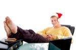 Relaxing Male Wearing Christmas Hat Stock Photo