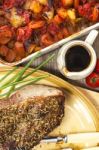 Roast Beef Joint With Roast Vegetables Stock Photo