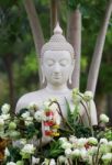 Buddhism Worship With Offering Flowers And Garland To Buddha Statue On Magha Puja, Asalha Puja And Visakha Puja Day In Thailand Stock Photo