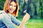 Woman Holding Spring Flower Stock Photo