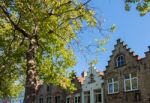 Buildings Alongside A Canal  In Bruges West Flanders In Belgium Stock Photo