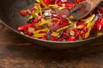 Fried Chili Pepper And Vegetable On A Wok Pan Stock Photo