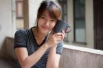 Portrait Of Thai Adult Beautiful Girl Drinking Coffee Stock Photo