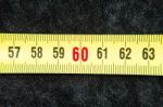 Centimeters Near A Tape Measure On The Number Sixty Stock Photo