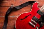 Electric Guitar On Wood Background Illuminated By Natural Daylight Stock Photo