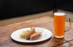 Sausages With Vegetables And Mug With Beer Stock Photo