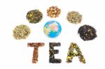 Word Tea With Globe And Various Heaps Of Tea Species Stock Photo