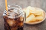 Iced Cola With Potato Chips Stock Photo