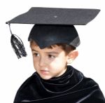 Cute Kid Graduate With Graduation Cap Stock Photo