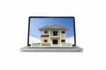 House On Laptop  Stock Photo