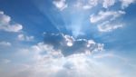 Sunbeam  Through The Haze On Blue Sky Stock Photo